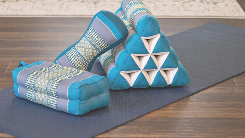Yoga pillows on a mat